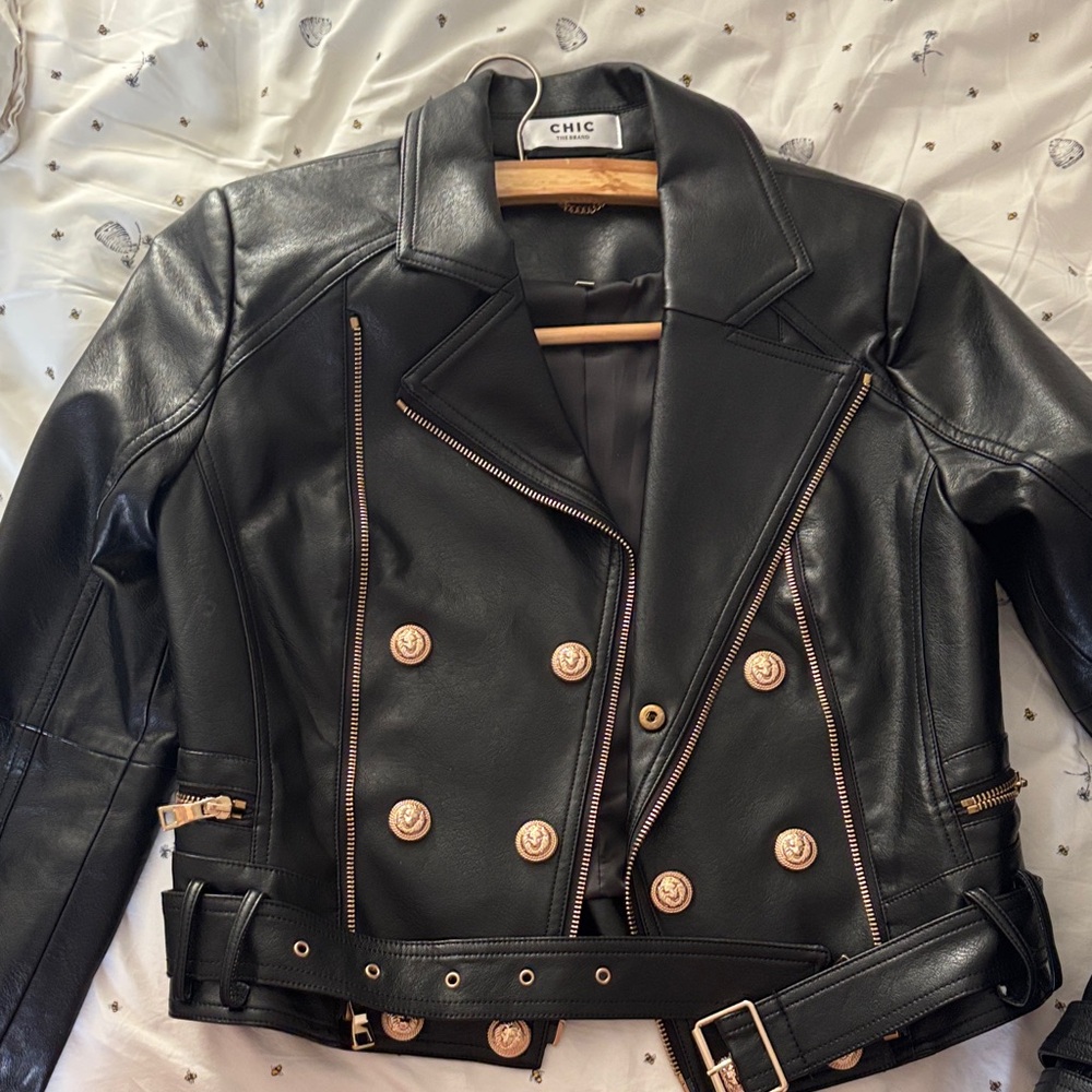 Elegant Black Leather Jacket with Gold Accents